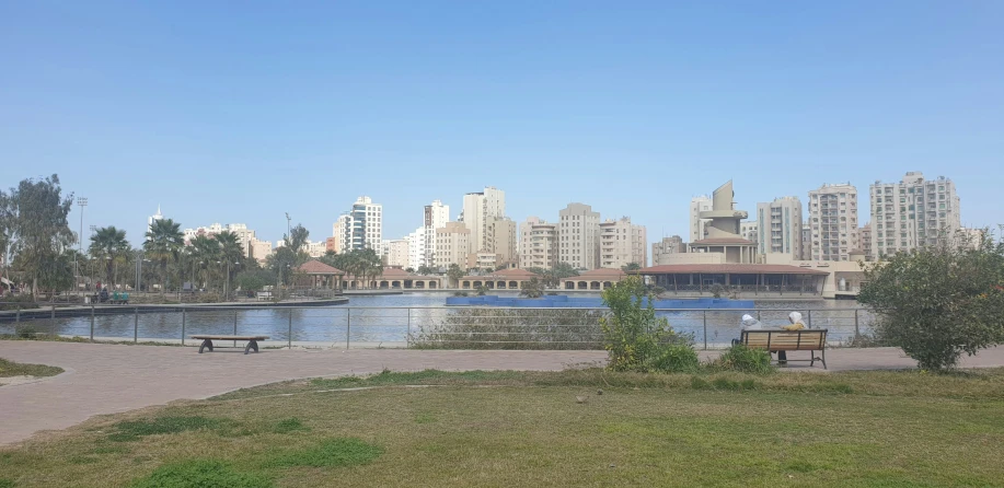 a large body of water next to tall buildings