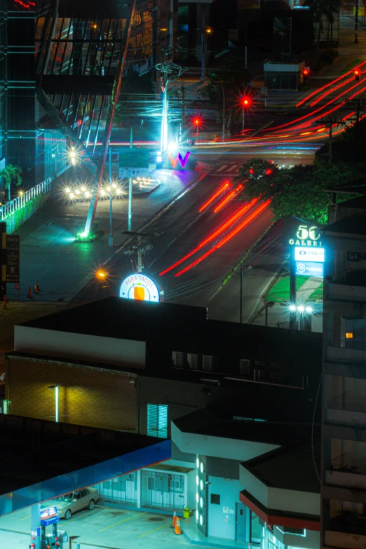 city street intersection in an area with cars passing through