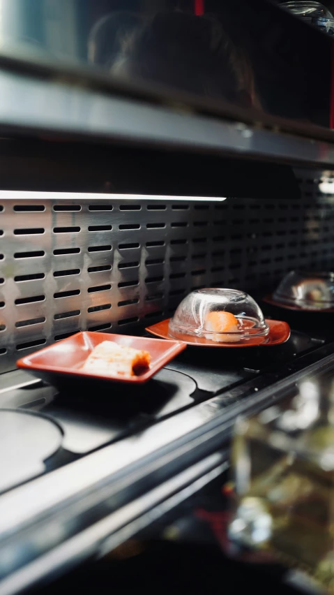 three plates are set on the stove top