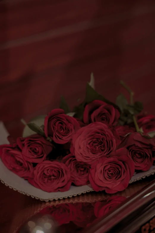 flowers are displayed in a vase on the table