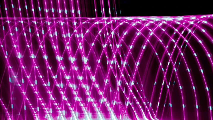 purple light reflecting through strings in the air