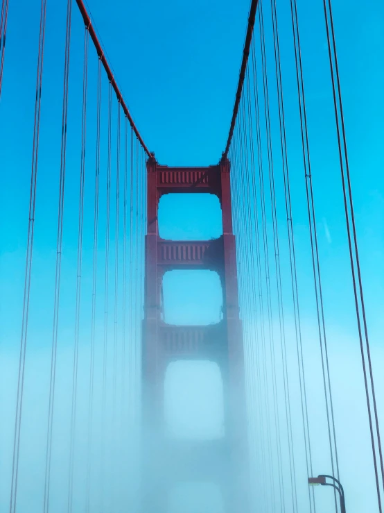 the golden gate bridge is very tall and it is foggy