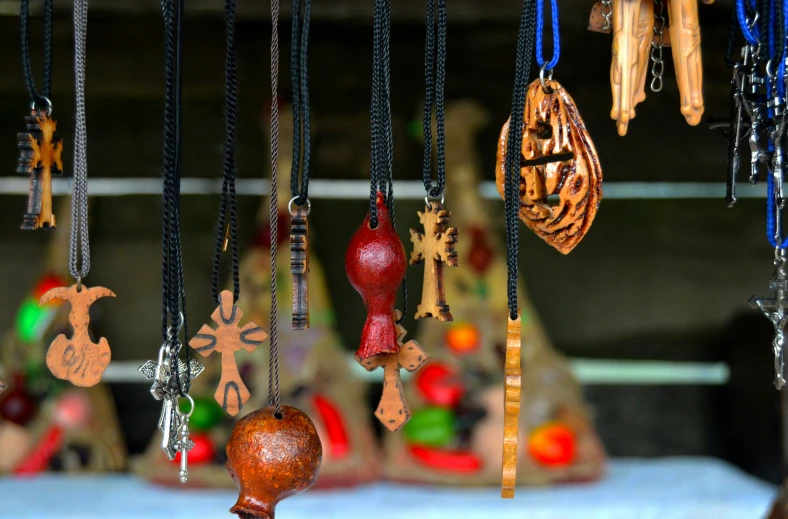 a number of different items hanging from chains