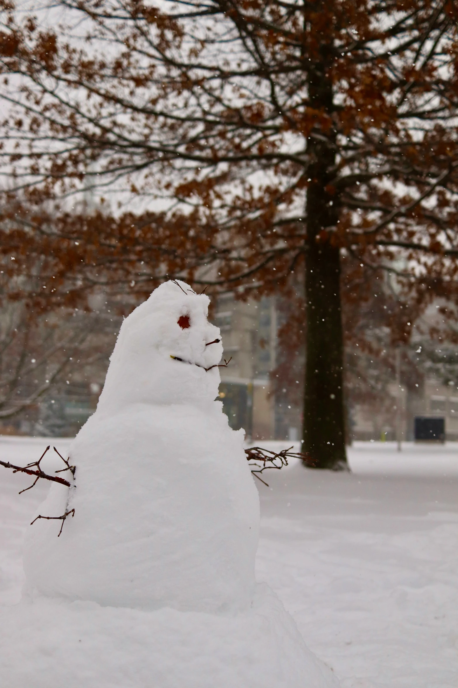 a snowman outside is in the middle of the snow