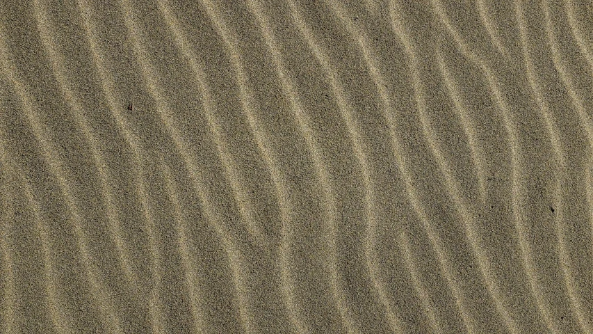 brown sand texture with some waves in it