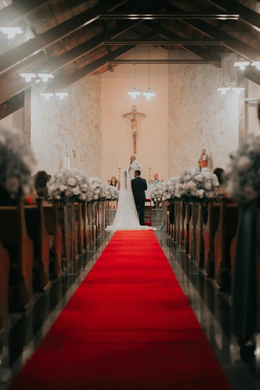 a wedding couple is walking down the aisle