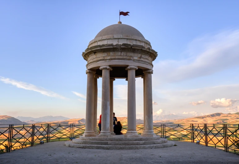 a couple standing at the top of a tower