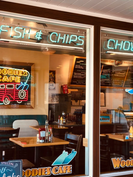 two sets of windows in a diner's fast and chips shop