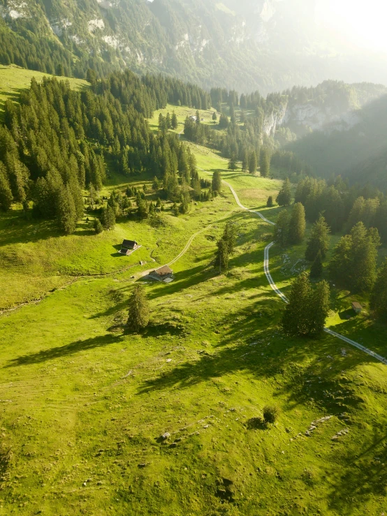 a scenic view of a road running through a mountain area