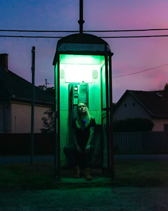 a woman at the public toilet with green light