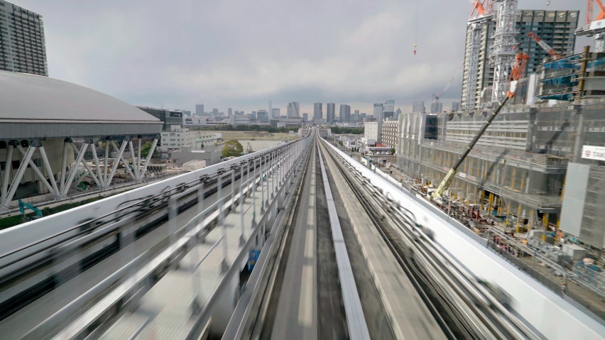 looking down at a bridge with trains driving through it