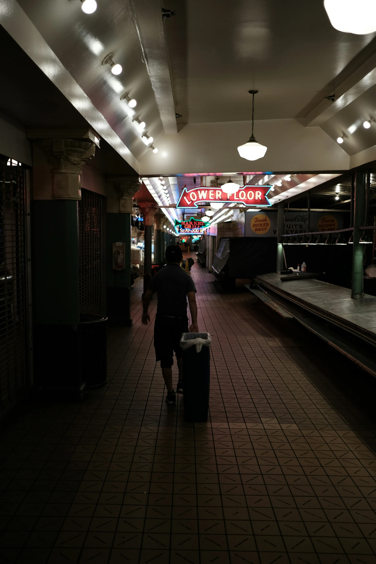 an empty subway with people walking along it