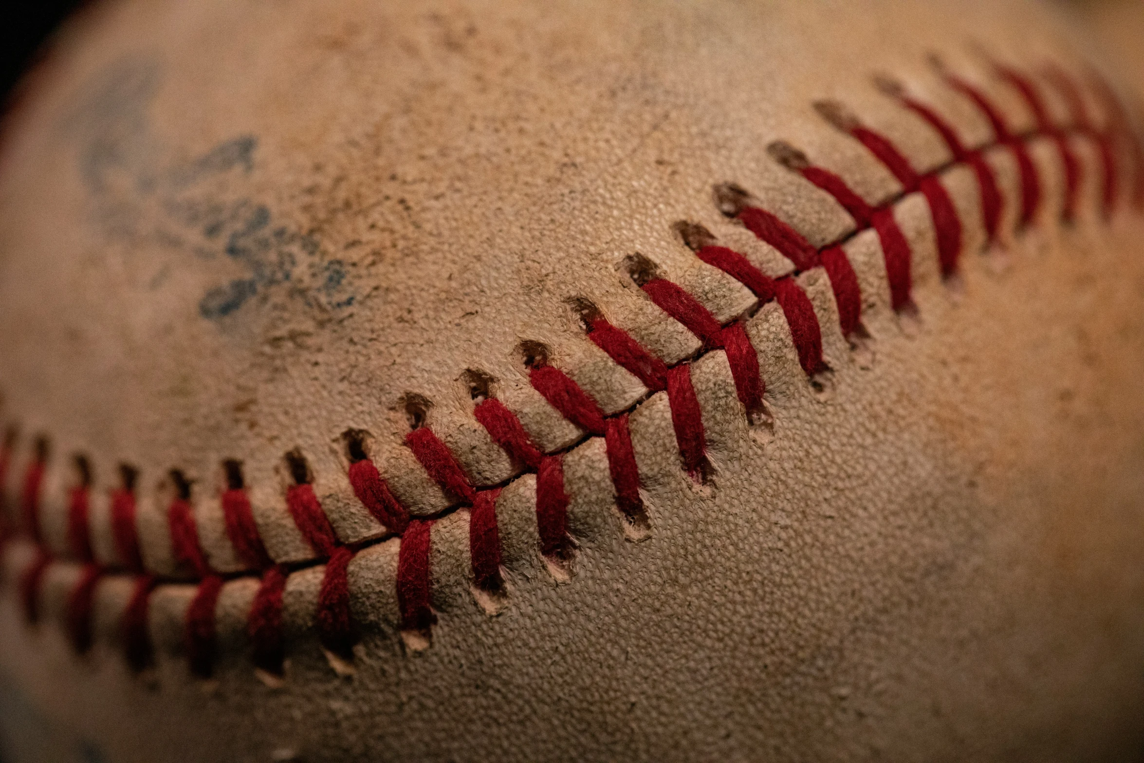 the stitches on an old baseball ball