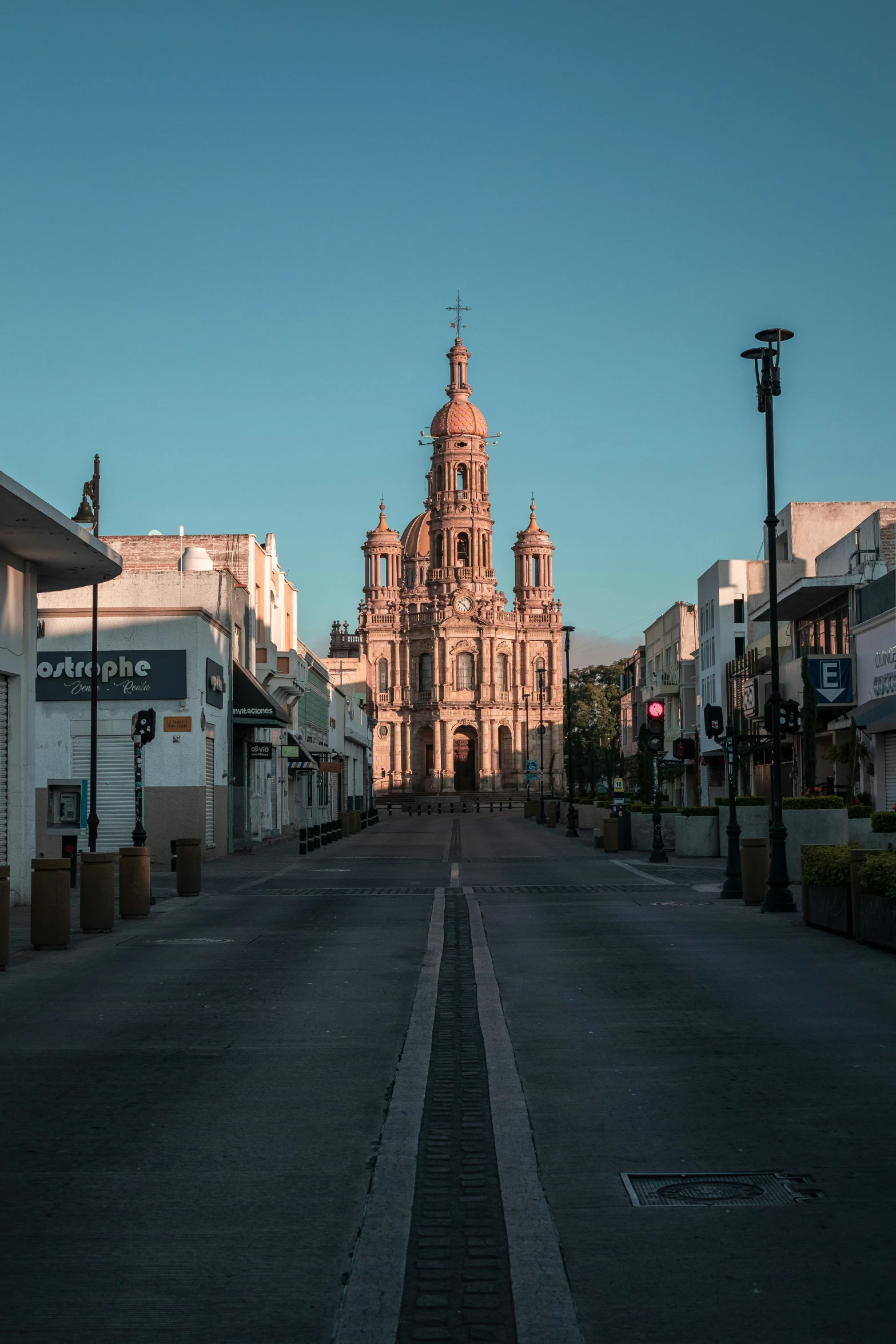 a street with a large building behind it