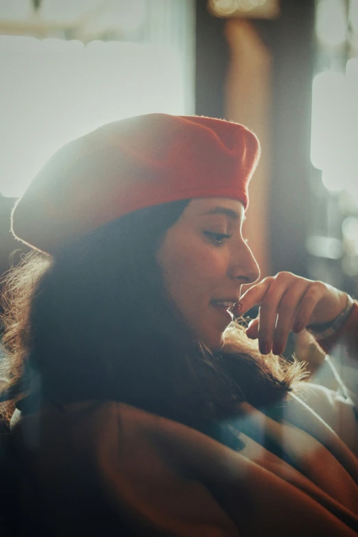 a young woman is wearing a red hat and a red sweater