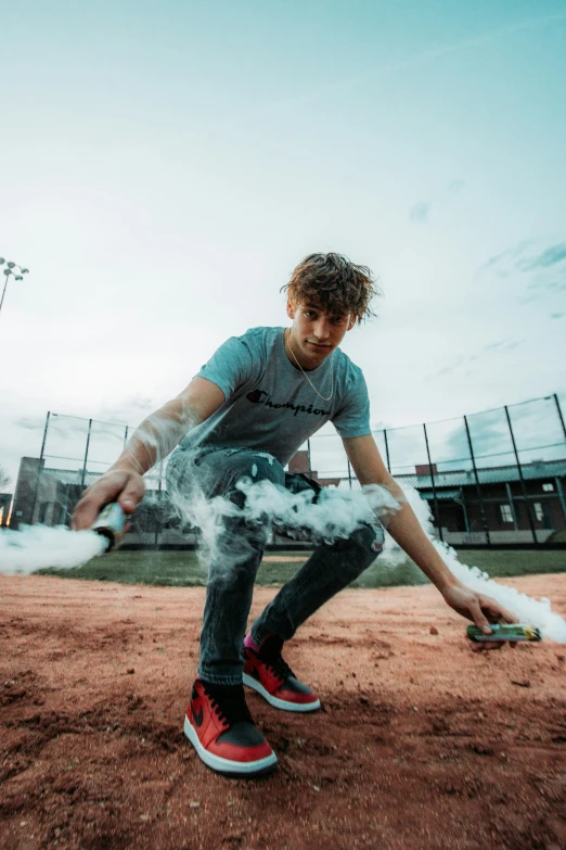 a man is throwing a baseball with smoke coming from it