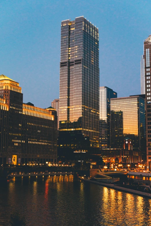 several tall buildings are shown along the water