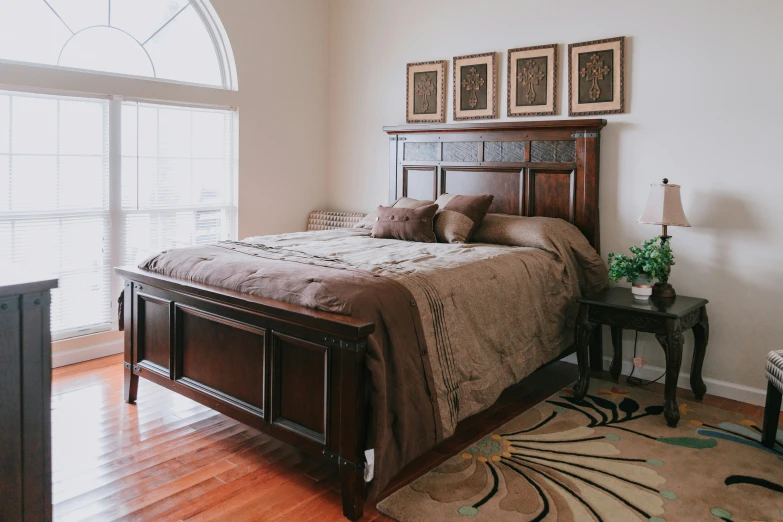 a large bed is in the corner of a bedroom