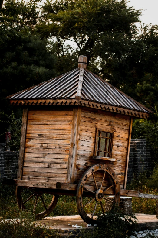 an old wooden wagon being used as a house