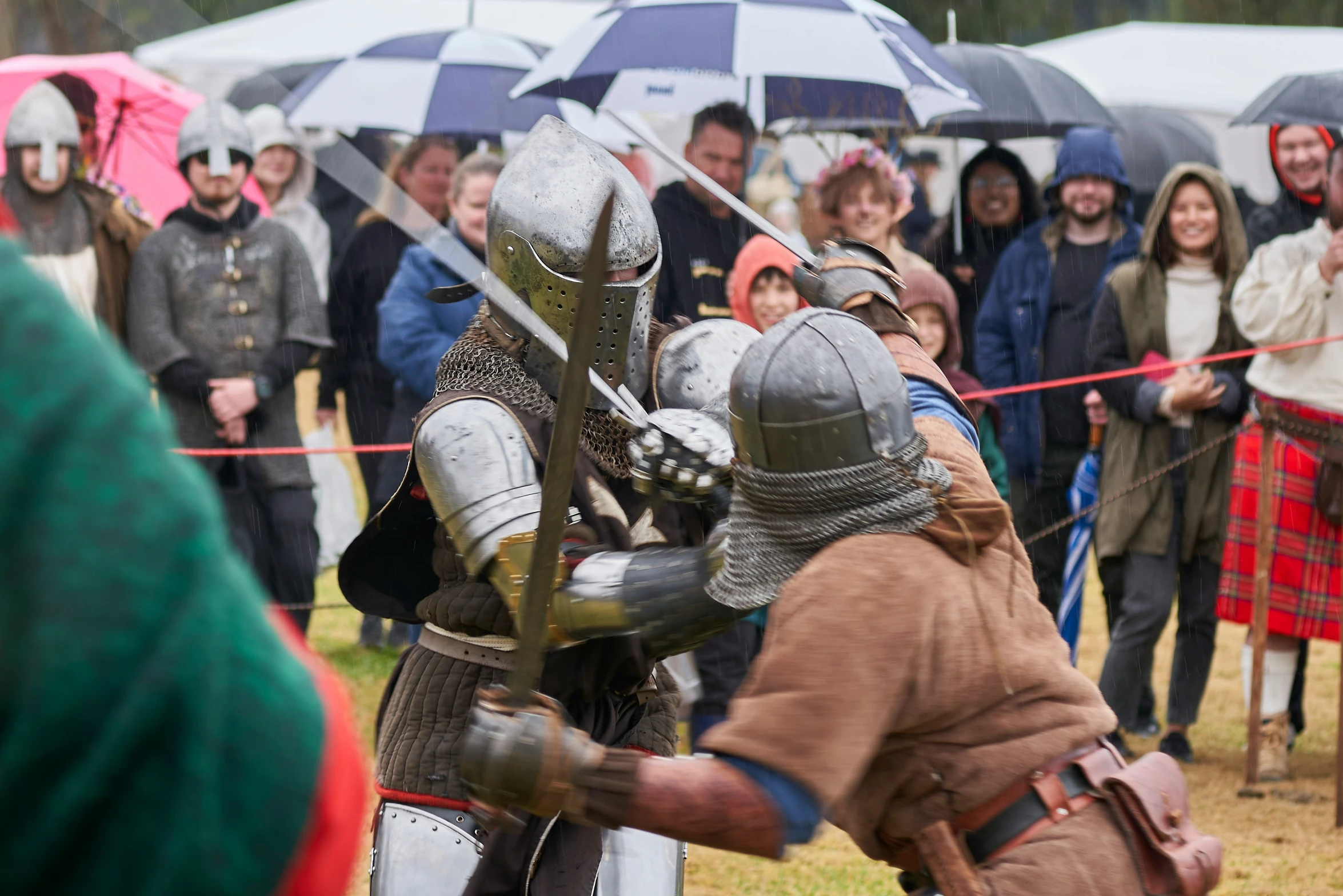 a knight in the middle of fighting a man with a sword