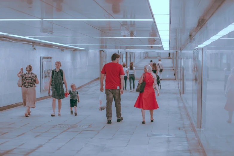 people are walking inside an industrial building