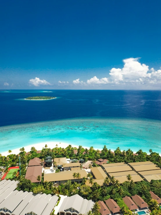 an aerial s of a tropical island surrounded by water