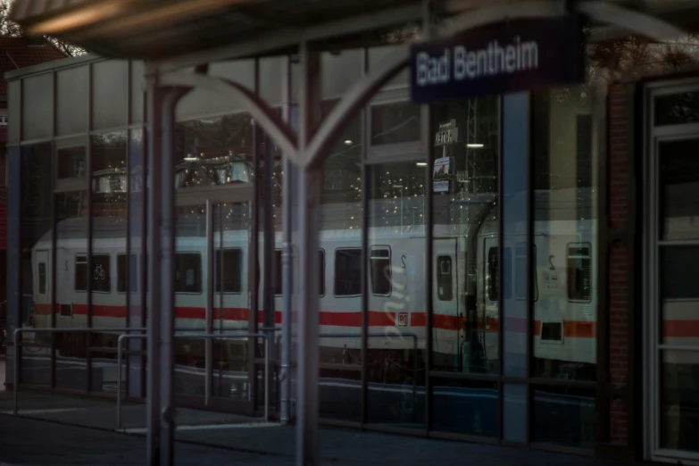 a train is traveling on the tracks near a platform