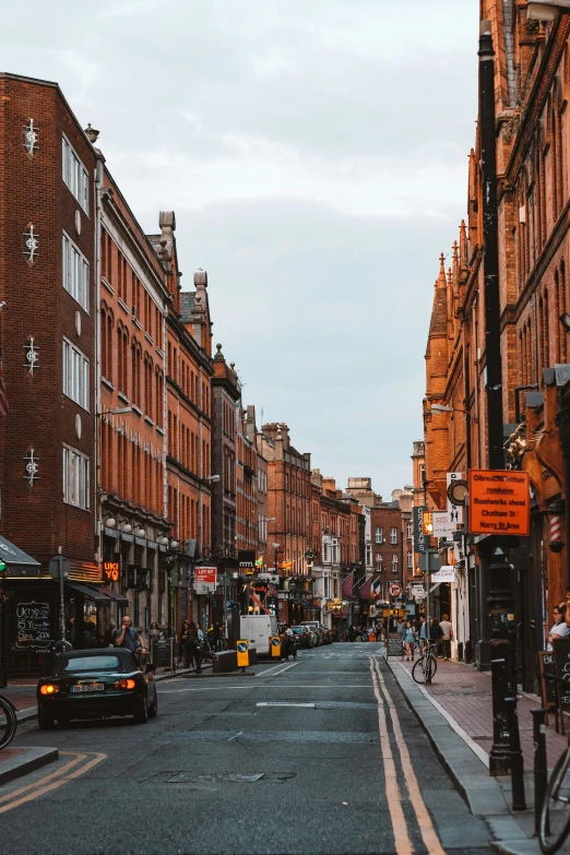 a very busy city street in the evening