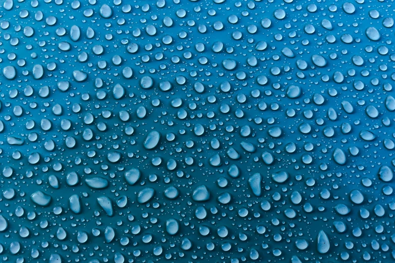 water droplets are covering the surface of a large blue sky