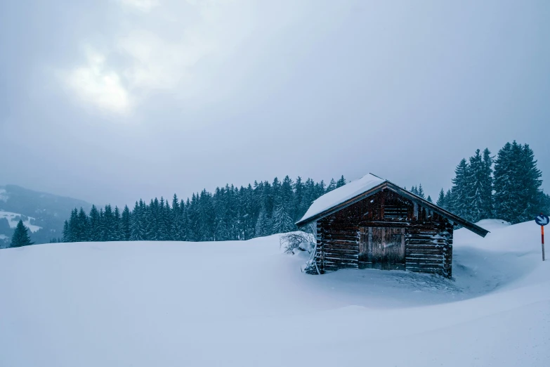 a building on top of snow covered slope