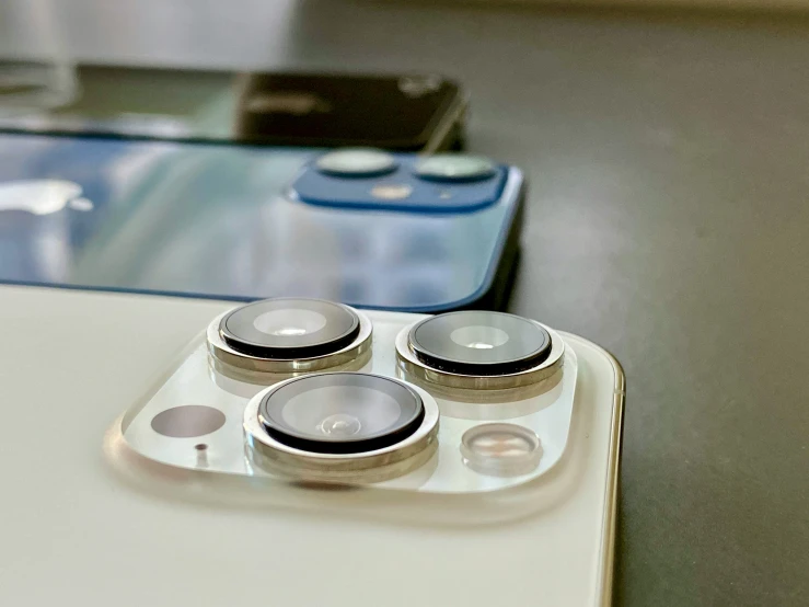 a smart phone sitting on top of a table next to a game controller