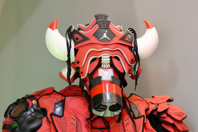 a red helmet that is covering it with some white horns