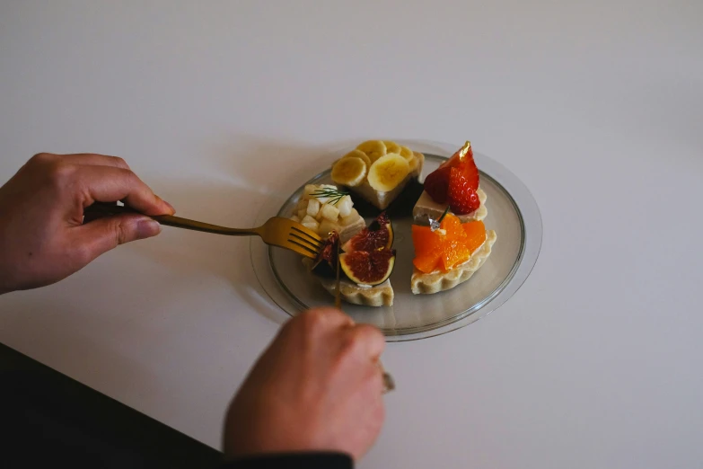 a plate with food is being handed over the table