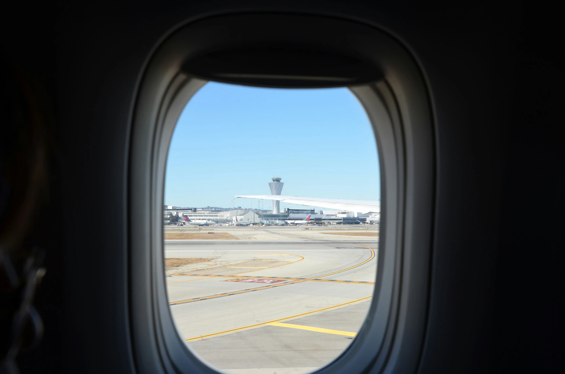 an airplane window as seen from an airplane on the ground