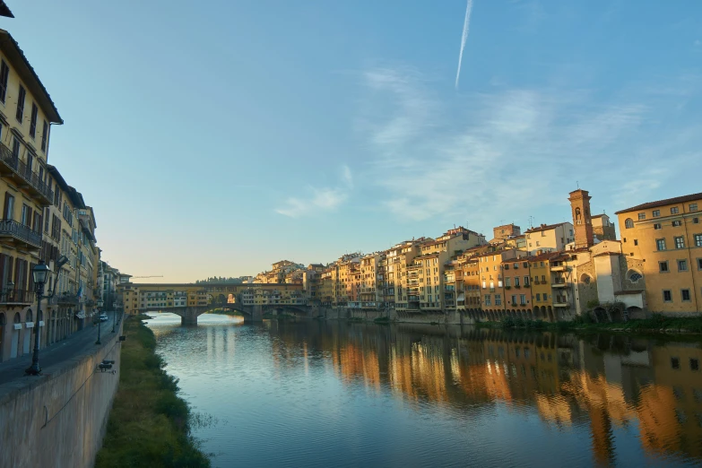 a view of several old buildings next to a river