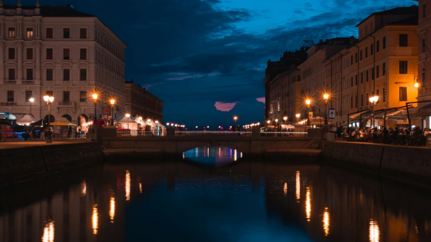 a body of water that is next to a street light