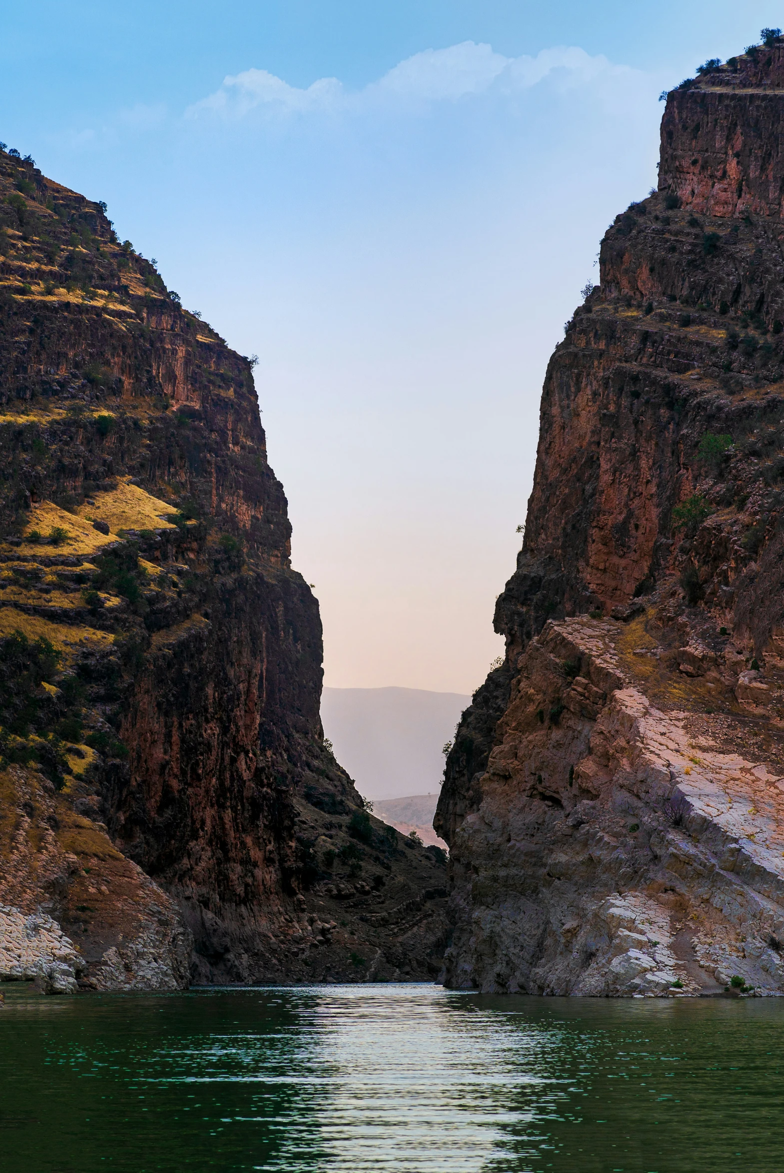 a group of mountains with water underneath them