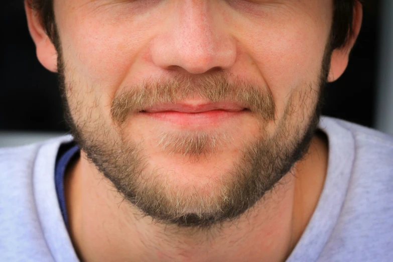a bearded male with blue eyes and a beard