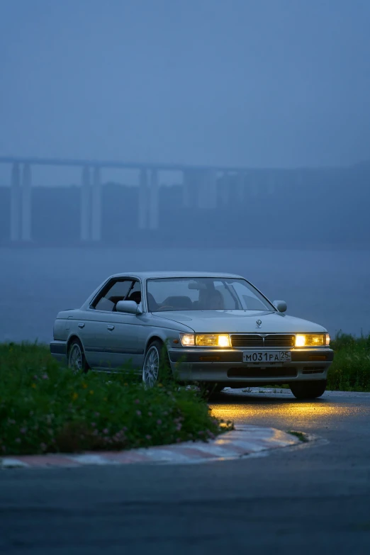 a car is parked in a foggy street