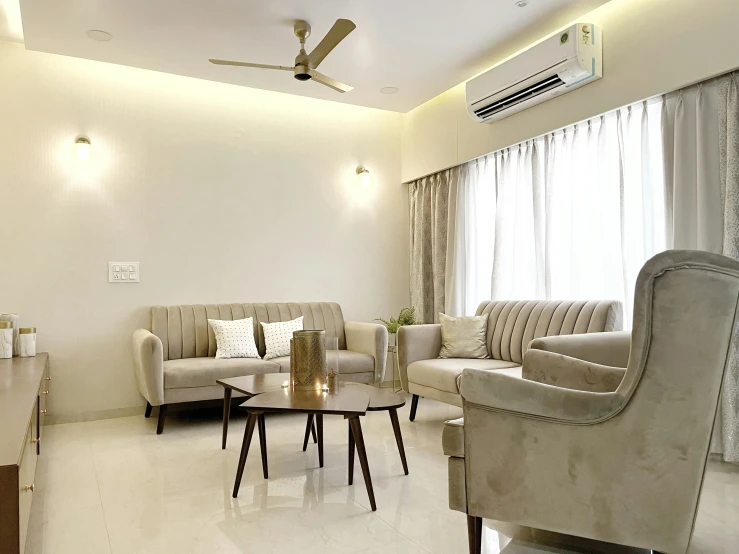 a living room with white and tan color scheme