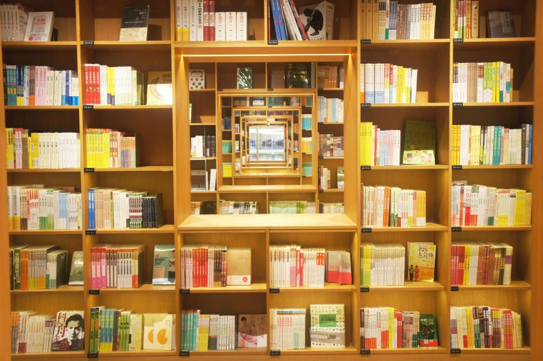 many books are on shelves beside a doorway