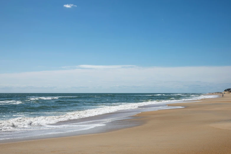 a view of the ocean and sand at a beach