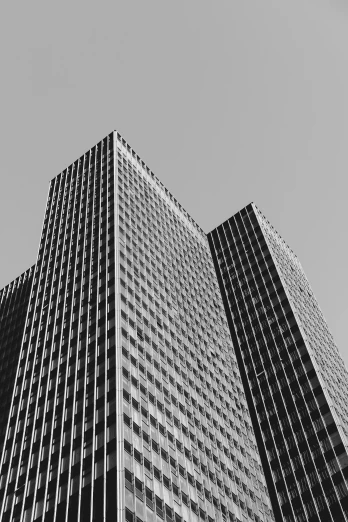 the large building is black and white while looking up at it