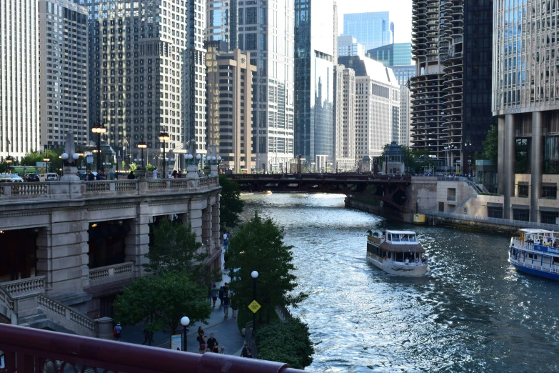 the waterway is busy with people boating through the buildings