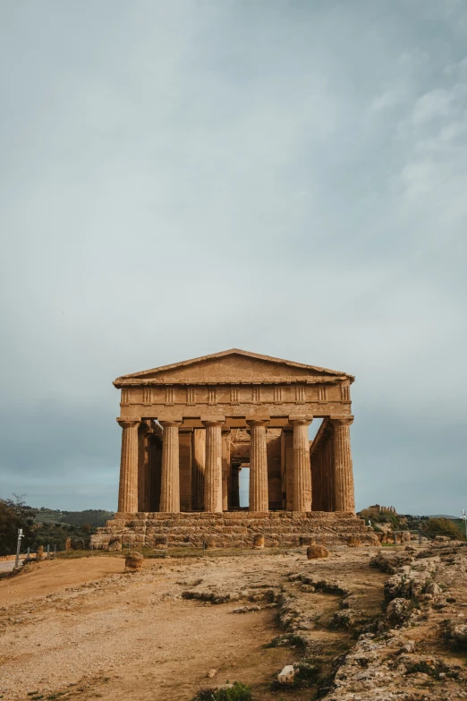 a large stone structure sitting on the top of a hill