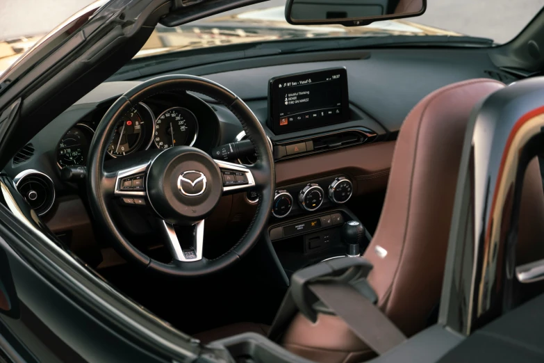 a dashboard of a new, sleek car is pictured