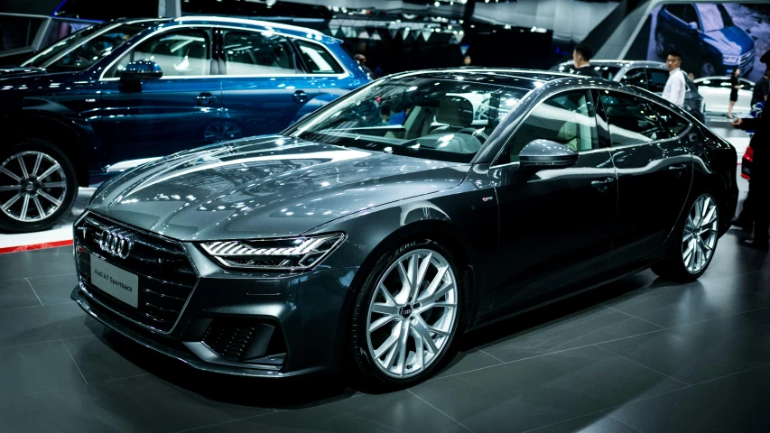 the front of an audi car, parked on display