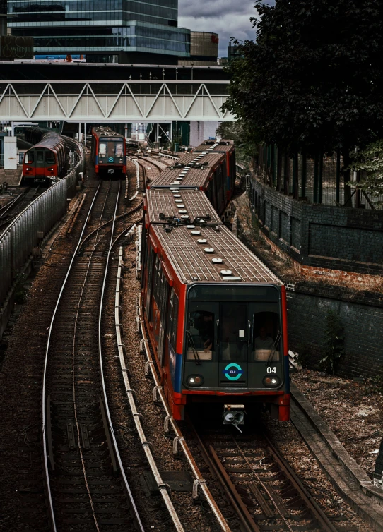 a train coming up the tracks at a station