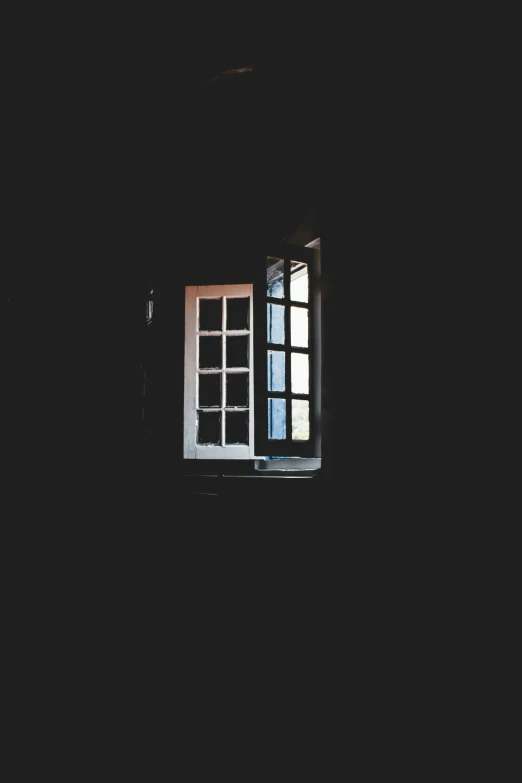 a window lit up in the dark by a light