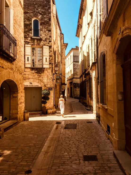 the woman is standing on the side of the street